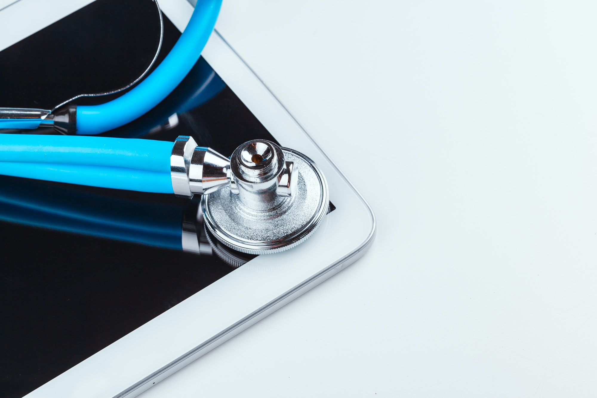 stethoscope and a digital tablet